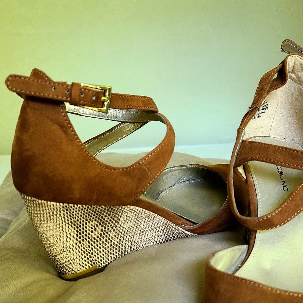 Tan suede wedge shoes.